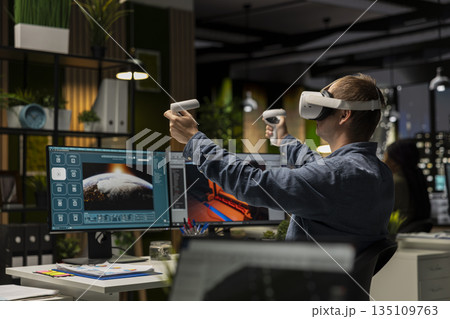 Professional male developer operating VR glasses to create spaceship station as game lobby, gaming development for the industry. AI generating modern spatial project on dual monitors. Professional male developer operating VR glasses to create spaceship station as game lobby, gaming development for the industry. AI generating modern spatial project on dual monitors. 135109763