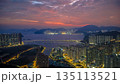 Dec 31 2022 Twilight colors glowing over calm Tseung Kwan O bay 135113521