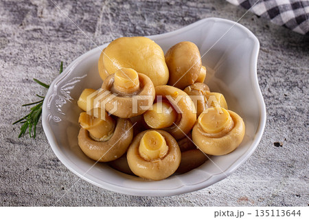 Marinated pickled champignon in the bowl 135113644
