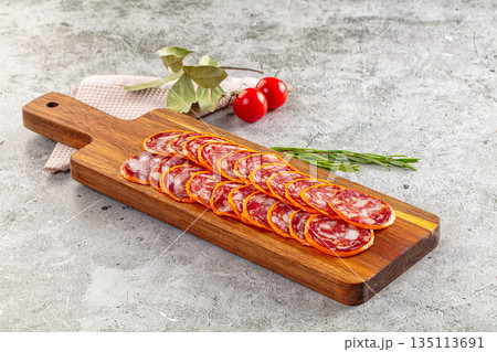 Spicy salami sausage in the cheese 135113691