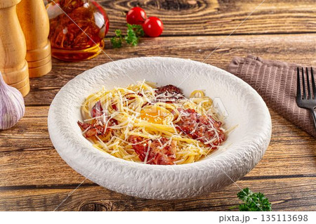Italian classic spaghetti carbonara with bacon and egg 135113698