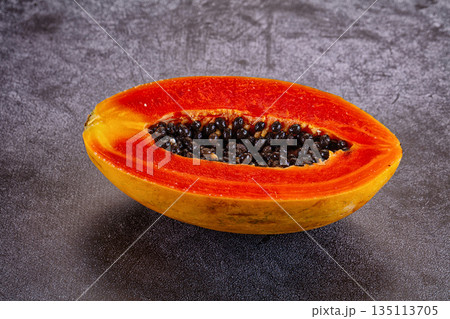 Sweet juicy tropical papaya cut half 135113705