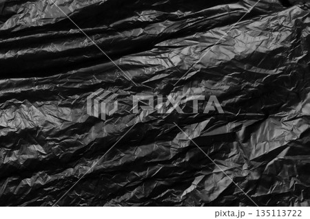 garbage bag is crumpled dark black garbage bag is crumpled dark black 135113722
