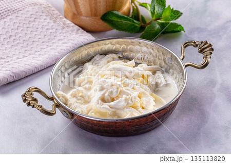 Italian soft young stracciatella cheese 135113820