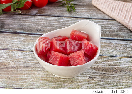 Raw tuna fish cubes heap 135113860