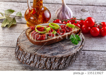 Baked eggplant with tomato and leek 135113927