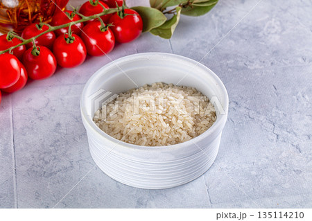 Raw dry white rice grain Raw dry white rice grain 135114210