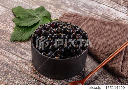 Sweet juicy Black currants berries 135114490