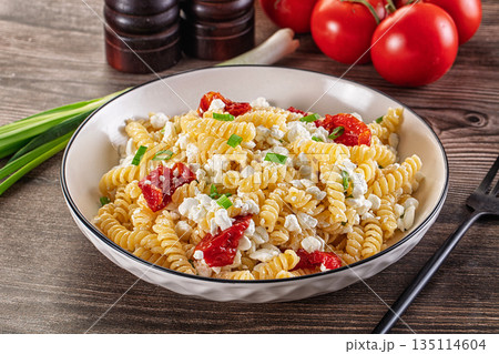 Italian pasta fusili with curd 135114604