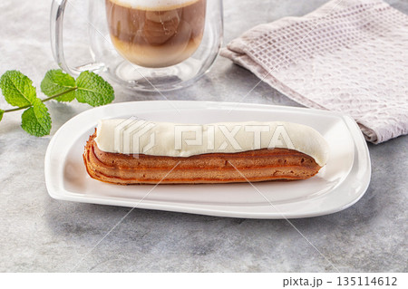 White vanilla eclair with icing White vanilla eclair with icing 135114612