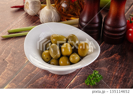 Greek green olives marinated in the bowl Greek green olives marinated in the bowl 135114652