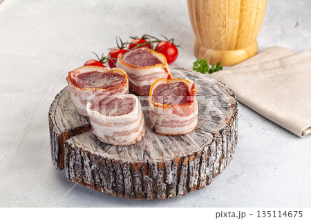 Raw pork tenferloin with bacon Raw pork tenferloin with bacon 135114675