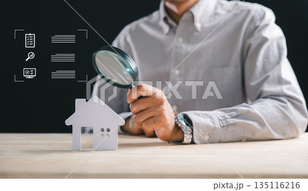 Man performs real estate home appraisal, using magnifying glass to appraise property details for thorough valuation, comprehensive search for prospective buyers or diligent inspector Man performs real estate home appraisal, using magnifying glass to appraise property details for thorough valuation, comprehensive search for prospective buyers or diligent inspector 135116216