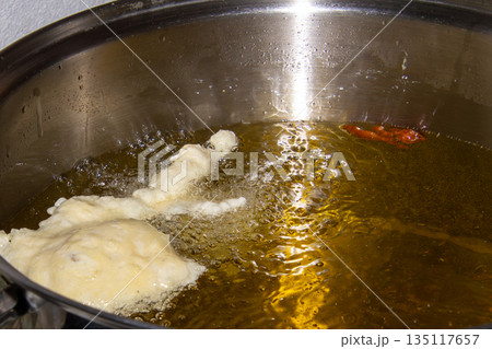 Frying doughnuts for new years eve 135117657