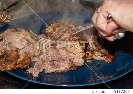Preparing a stew with pork roll 135117868