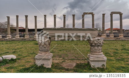 Agora of Smyrna, Izmir, Turkey. Ancient Roman columns and archway under an overcast sky. Agora of Smyrna, Izmir, Turkey. Ancient Roman columns and archway under an overcast sky. 135119335
