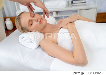 Caucasian woman enjoying relaxing anti-stress head massage. Quiescent 135119642