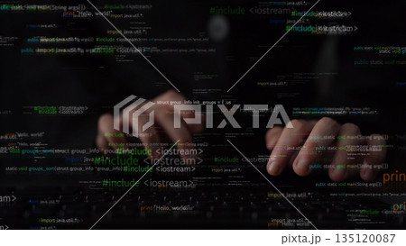 Close-Up View of a Programmer Hands Typing on a Laptop with Code and Data Streams Background in a Dark Environment xenic Close-Up View of a Programmer Hands Typing on a Laptop with Code and Data Streams Background in a Dark Environment xenic 135120087
