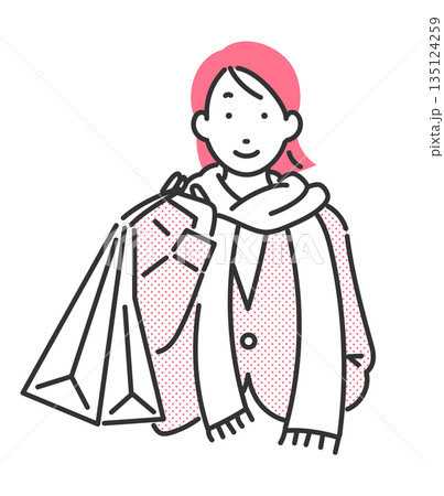 買い物袋を下げている冬物コーデの女性 買い物袋を下げている冬物コーデの女性 135124259