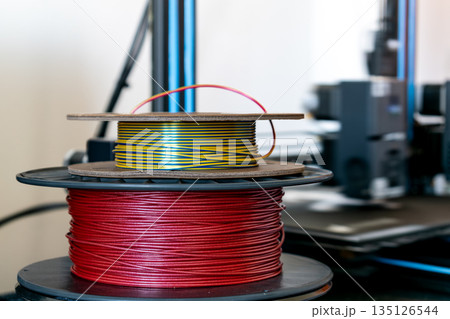 Spool of yellow pla filament for printing 3d printer 135126544