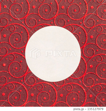 Elegant swirl pattern with white circle on red background Elegant swirl pattern with white circle on red background 135127979
