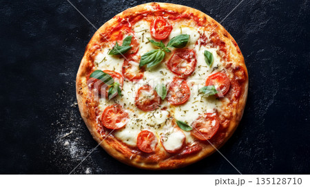 Traditional Margherita pizza with tomatoes, mozzarella and basil on dark background 135128710
