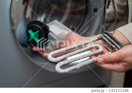 Repair and maintenance of washing machine heater and pump parts, cleaning from limescale buildup Repair and maintenance of washing machine heater and pump parts, cleaning from limescale buildup 135131186