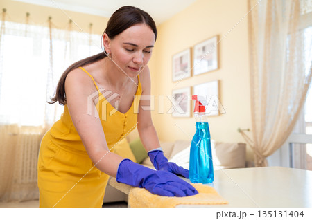 woman, young, happy, smiling, gloves, cleaning, wiping, table, cloth, home care, tidy, domestic, household, cheerful, casual, lifestyle, neat, domestic work, protection, rubber gloves, surface, 135131404
