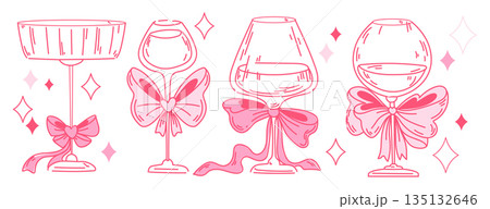 Cocktail glasses with pink bows and sparkles Cocktail glasses with pink bows and sparkles 135132646