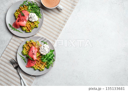 Healthy breakfast with green avocado based waffles and salmon Healthy breakfast with green avocado based waffles and salmon 135133681
