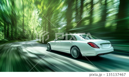 White luxury sedan driving fast on a winding road through a vibrant green forest, showcasing speed, automotive engineering, and connection with nature 135137467
