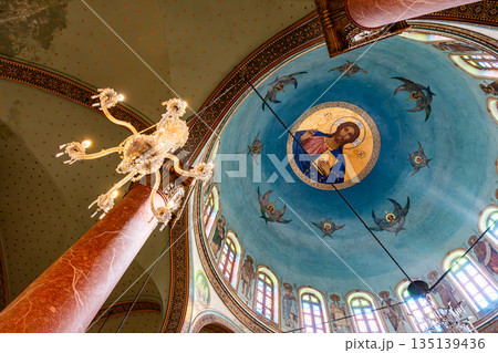 The interior of The Church of St. George in Cairo, Egypt. Drawing of Jesus under the ceiling. Coptic Cairo. Orthodox churches in Egypt. The interior of The Church of St. George in Cairo, Egypt. Drawing of Jesus under the ceiling. Coptic Cairo. Orthodox churches in Egypt. 135139436