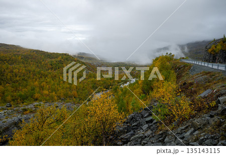Autumn forest landscape with river and misty hills in Finnish Lapland Autumn forest landscape with river and misty hills in Finnish Lapland 135143115
