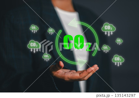 Visual representation of CO2 emission reduction with green symbols and arrows, highlighting sustainable energy concepts. Visual representation of CO2 emission reduction with green symbols and arrows, highlighting sustainable energy concepts. 135143297