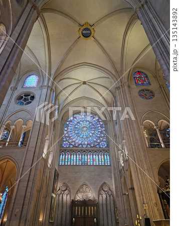 Paris, France - December 10, 2025: The stunning North Rose Window of Notre-Dame Cathedral. Vibrant stained glass and complex stone tracery of the transept. Immense scale Gothic arches and ceilings Paris, France - December 10, 2025: The stunning North Rose Window of Notre-Dame Cathedral. Vibrant stained glass and complex stone tracery of the transept. Immense scale Gothic arches and ceilings 135143892
