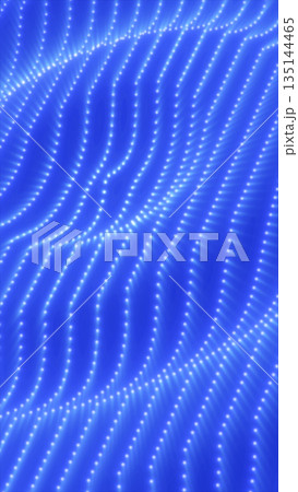 Abstract blue particle wave grid with glowing dots forming flowing digital curves, symbolizing data streams, technology, and futuristic motion 135144465