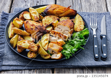 grilled juicy chicken breasts and roasted potatoes grilled juicy chicken breasts and roasted potatoes 135145074