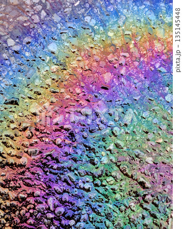 Oil Petrol Rainbow Leak Running over the road tarmac Oil Petrol Rainbow Leak Running over the road tarmac 135145448
