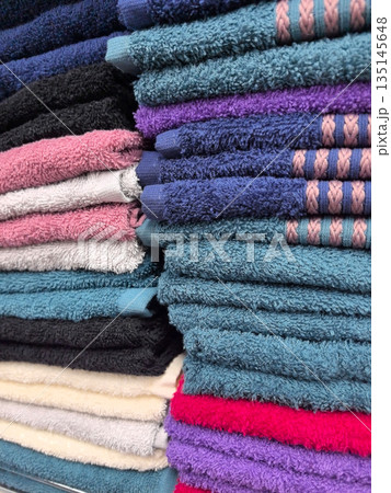 Vibrant towels in a cozy store display ready for home use Vibrant towels in a cozy store display ready for home use 135145648