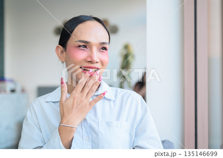 Portrait of a young Thai transgender business person at coffee shop Portrait of a young Thai transgender business person at coffee shop 135146699