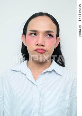 Portrait of a young bored Thai transgender business person against white background Portrait of a young bored Thai transgender business person against white background 135146839
