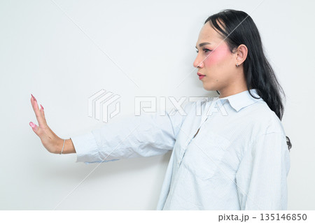 Profile view portrait of a young Thai transgender business person against white background 135146850