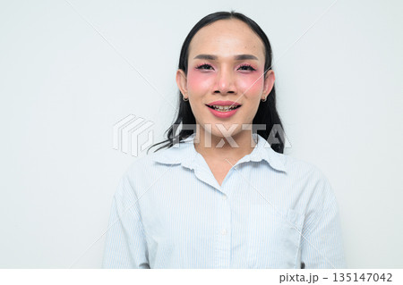 Portrait of a young Thai transgender person against white background Portrait of a young Thai transgender person against white background 135147042