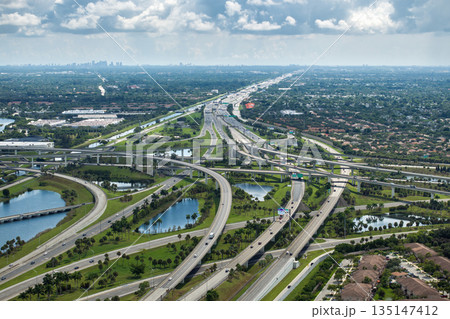 American highway junction with fast driving vehicles in Miami, Florida. USA urban transportation infrastructure American highway junction with fast driving vehicles in Miami, Florida. USA urban transportation infrastructure 135147412