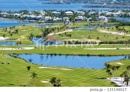 Aerial view of large golf field with green grass in Boca Grande, small town on Gasparilla Island in southwest Florida. Outdoor activities for wealthy people 135148027