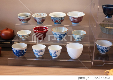 Variety Of Traditional Teacups Displayed In A Charming Setup 135148308