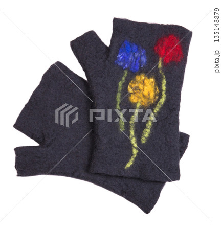 Mittens from felted wool on a white background Mittens from felted wool on a white background 135148879