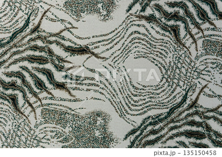 Light olive-gray jacquard fabric texture with metallic lurex and dark teal abstract pattern, textile collection Light olive-gray jacquard fabric texture with metallic lurex and dark teal abstract pattern, textile collection 135150458