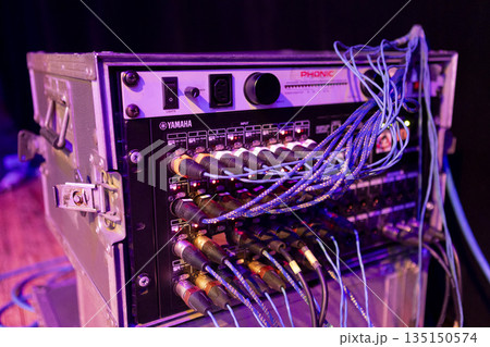 Switching stage equipment on the stage of a concert hall Switching stage equipment on the stage of a concert hall 135150574