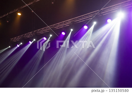Light from stage lighting equipment in a concert hall 135150580